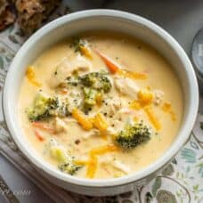 a bowl of broccoli soup with carrots and chicken