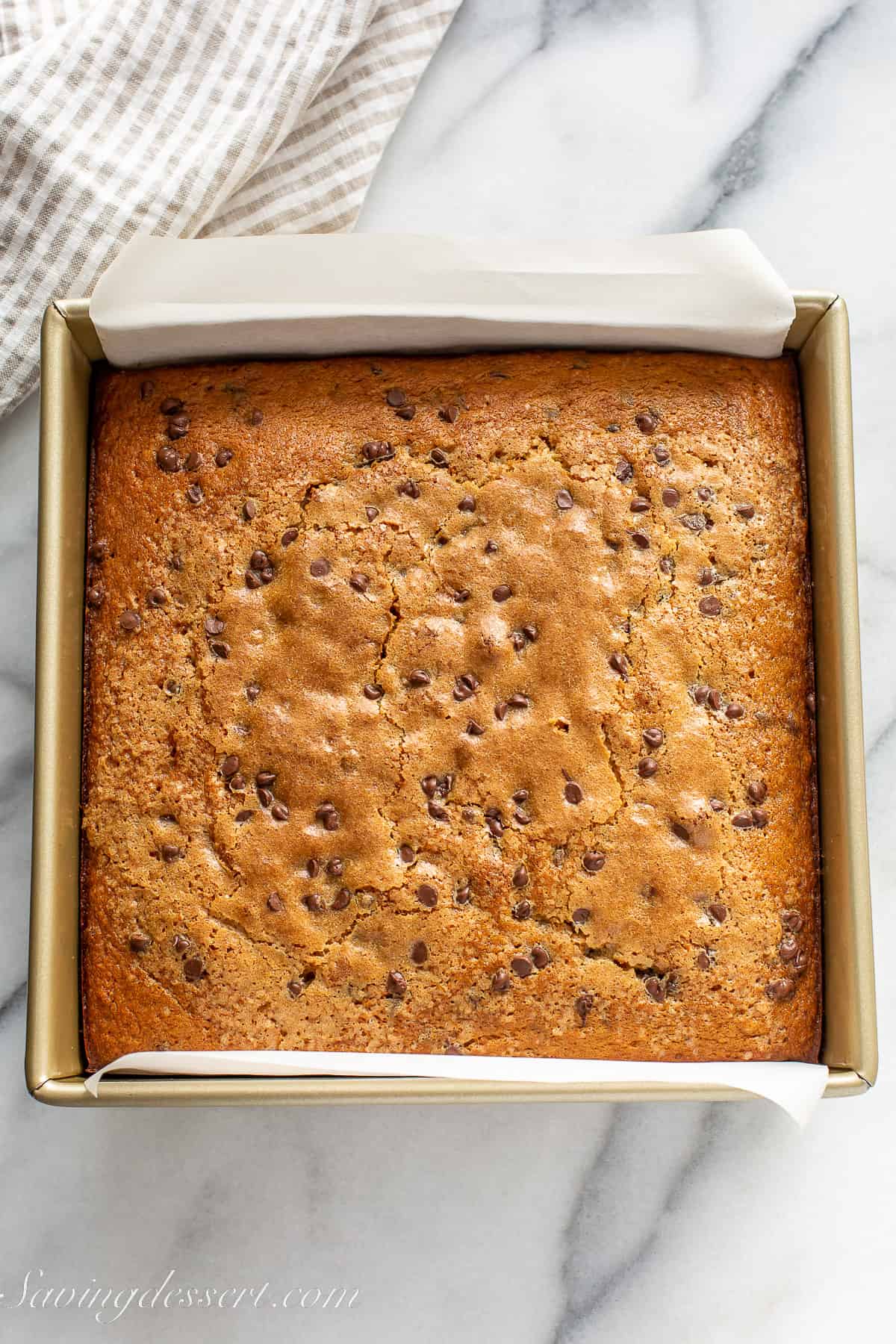 a golden brown baked banana chocolate chip cake in a pan