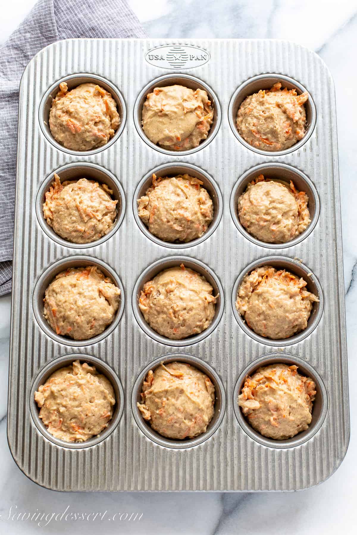 carrot cake muffins ready to go in the oven