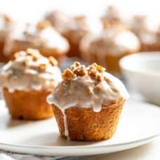 glazed carrot cake muffins on a plate
