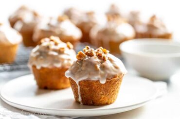 glazed carrot cake muffins on a plate