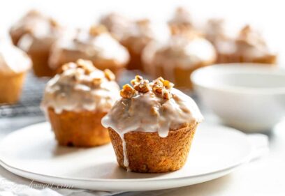 glazed carrot cake muffins on a plate