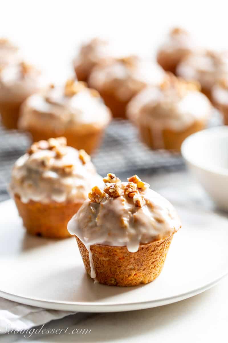 glazed carrot cake muffins on a plate