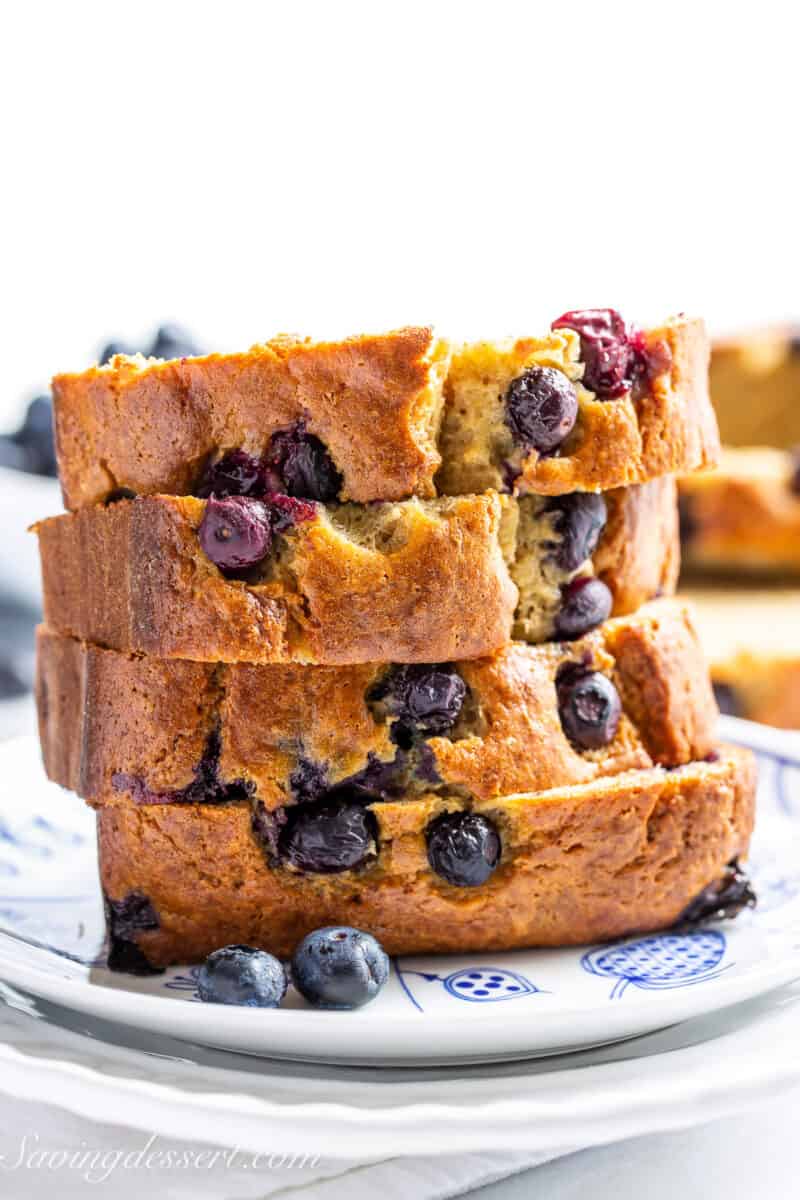 A side view of a stack of blueberry banana bread