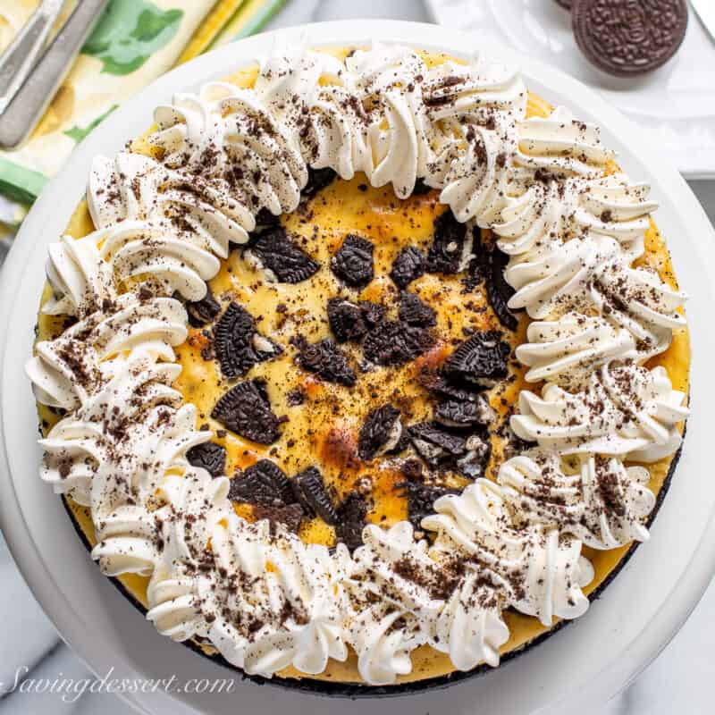 oreo cheesecake on a cake stand