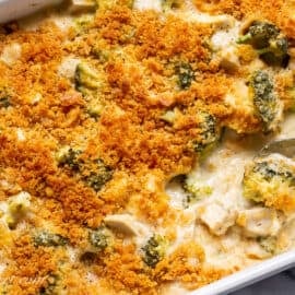 overhead view of a casserole with creamy white sauce, chicken and broccoli