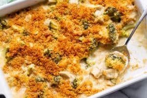 overhead view of a casserole with creamy white sauce, chicken and broccoli