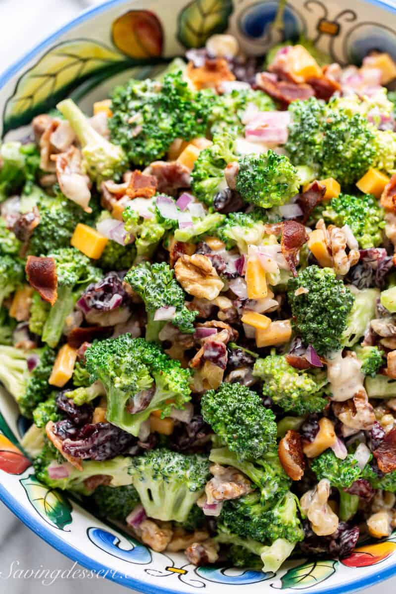 closeup of a bowl of broccoli salad recipe with cheddar cheese and bacon