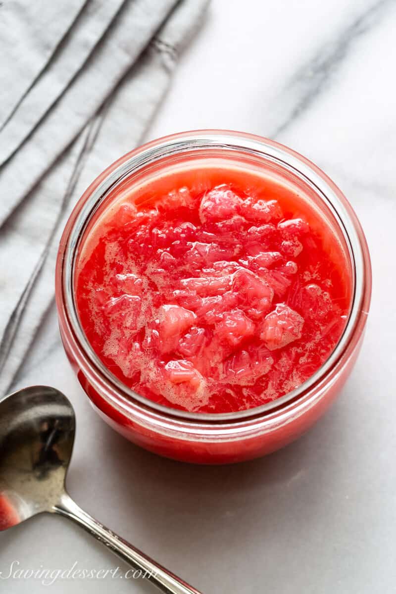 Overhead view of a wide mouth jar filled with homemade rhubarb sauce