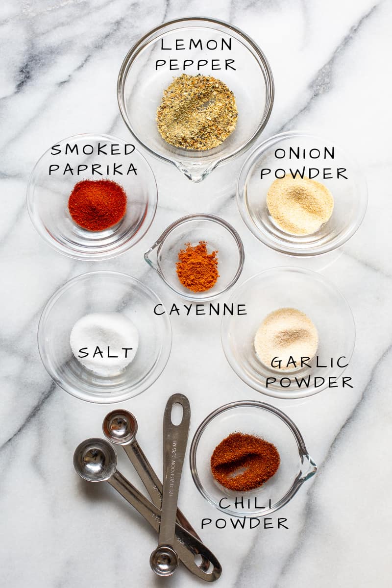 a collage of small bowls filled with various spices and measuring spoons