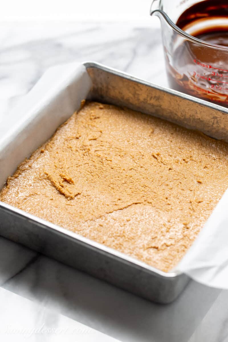 a pan of peanut butter filling for no bake peanut butter bars