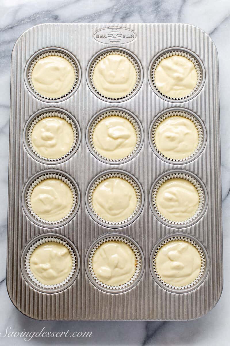 cheesecake batter in a muffin tin