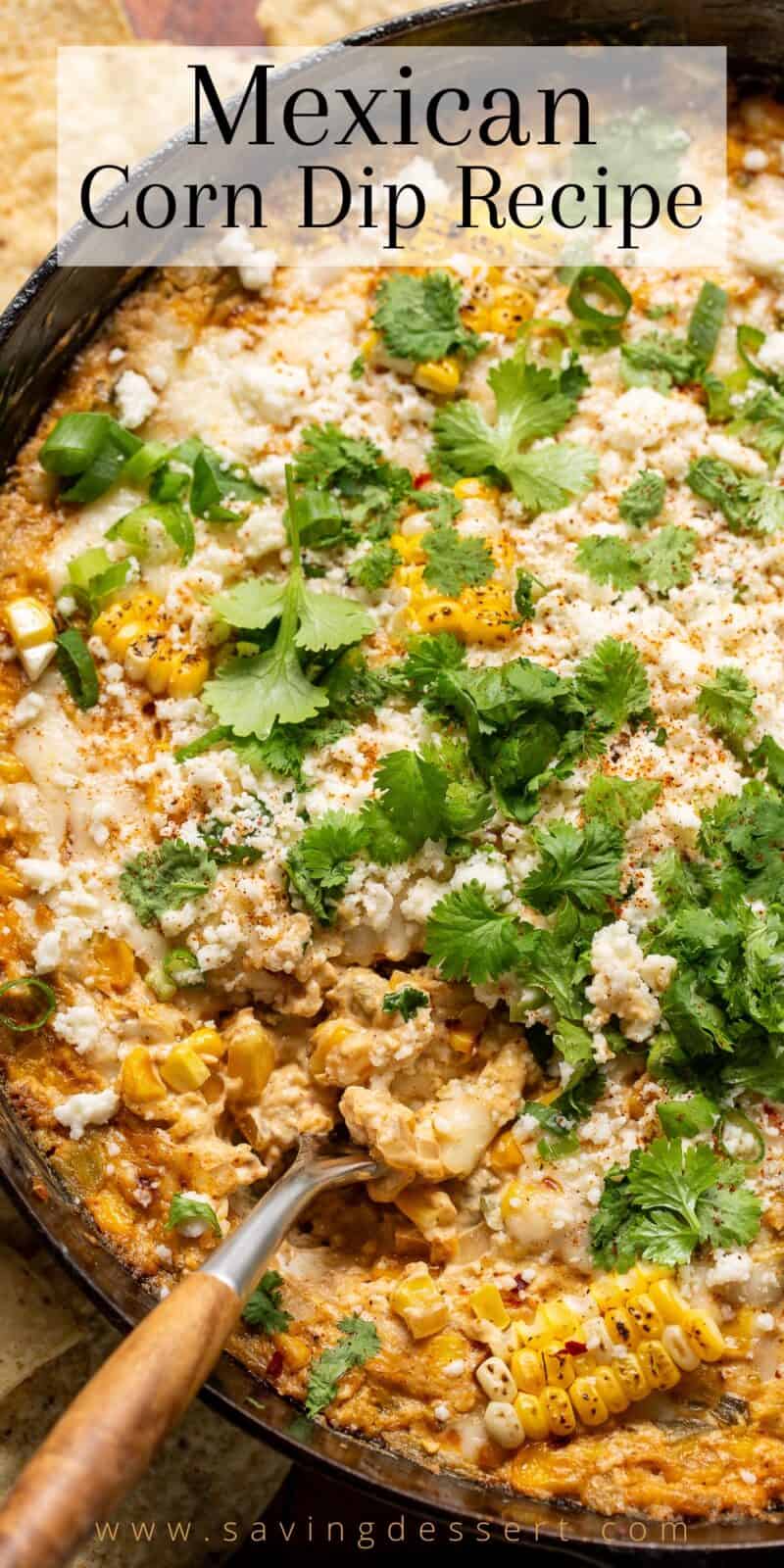 an overhead view of a cast iron skillet filled with hot mexican street corn dip