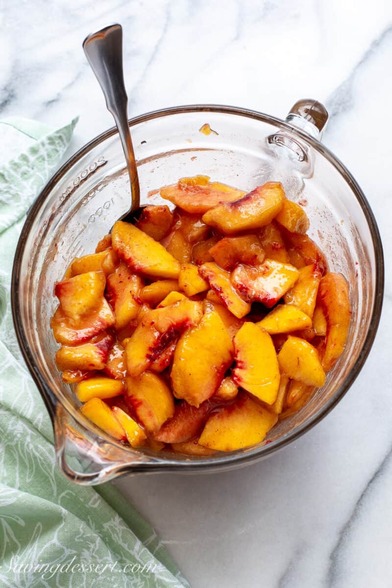 A bowl of sliced peaches.