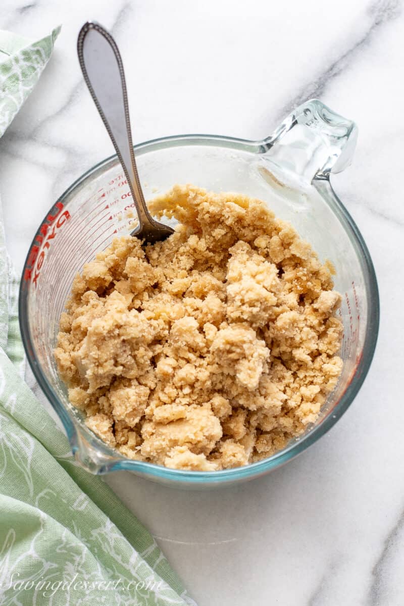 A bowl filled with a cinnamon crumble topping.