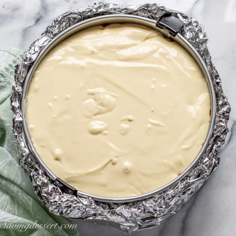 An unbaked cheesecake ready to go in the oven.