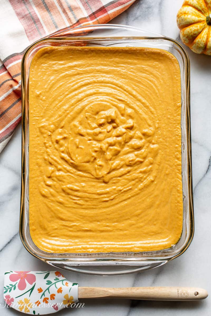 A baking pan with pumpkin pie filling.