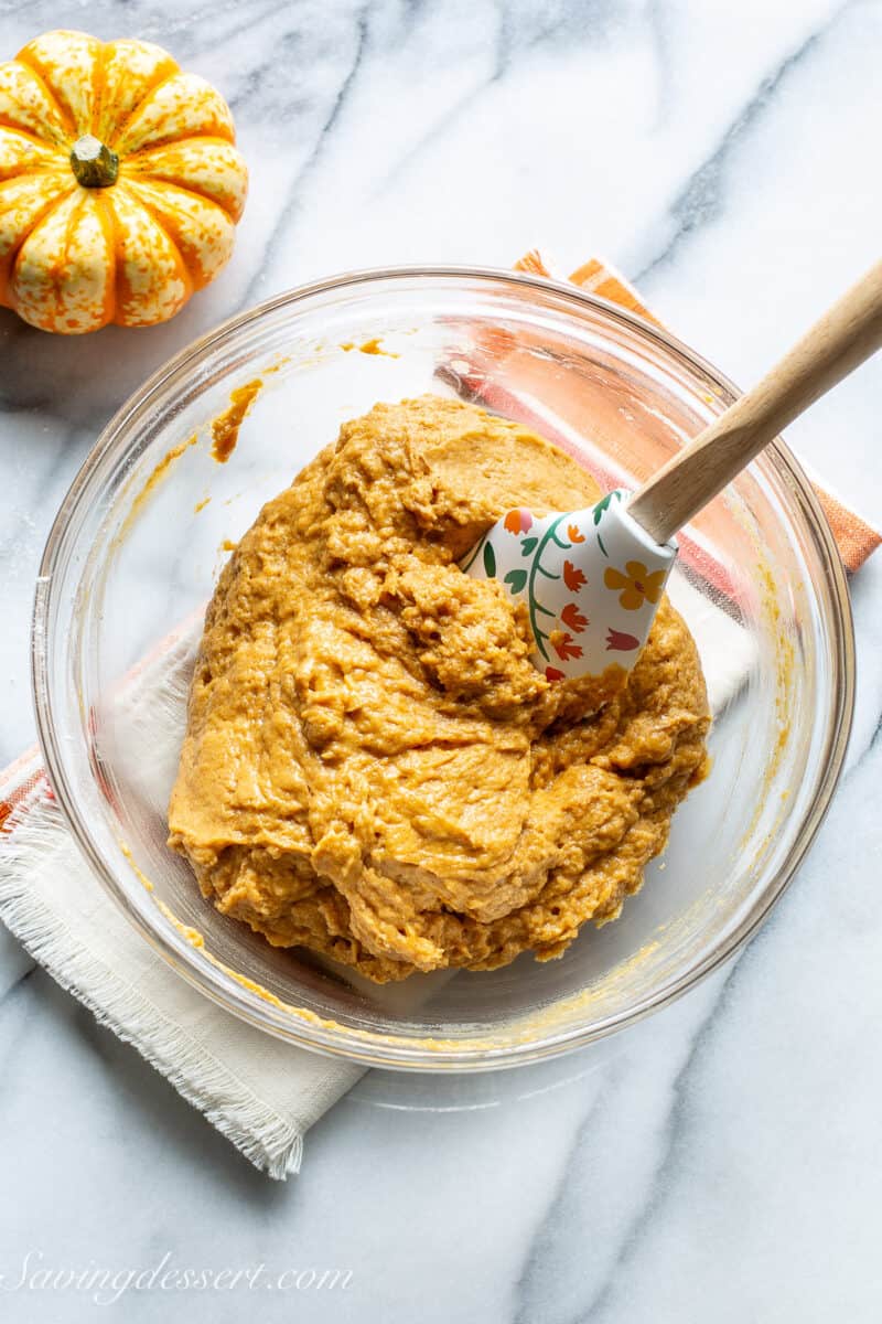 Pumpkin Muffin batter in a bowl with a spatula.