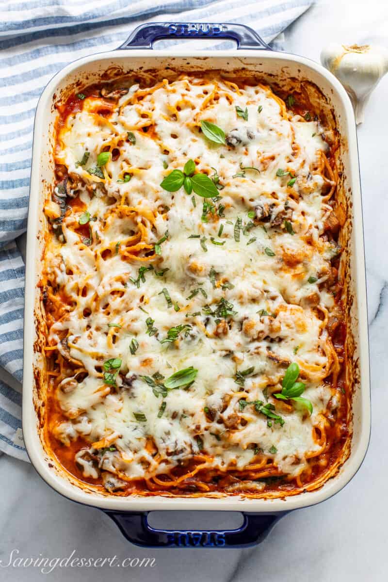 A casserole pan filled with baked spaghetti fresh out of the oven.