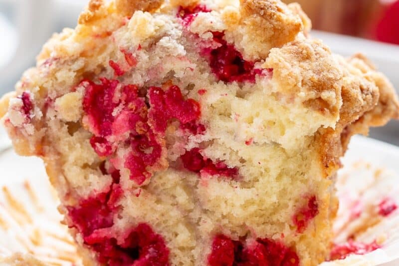 A closeup showing the inside of a raspberry muffin