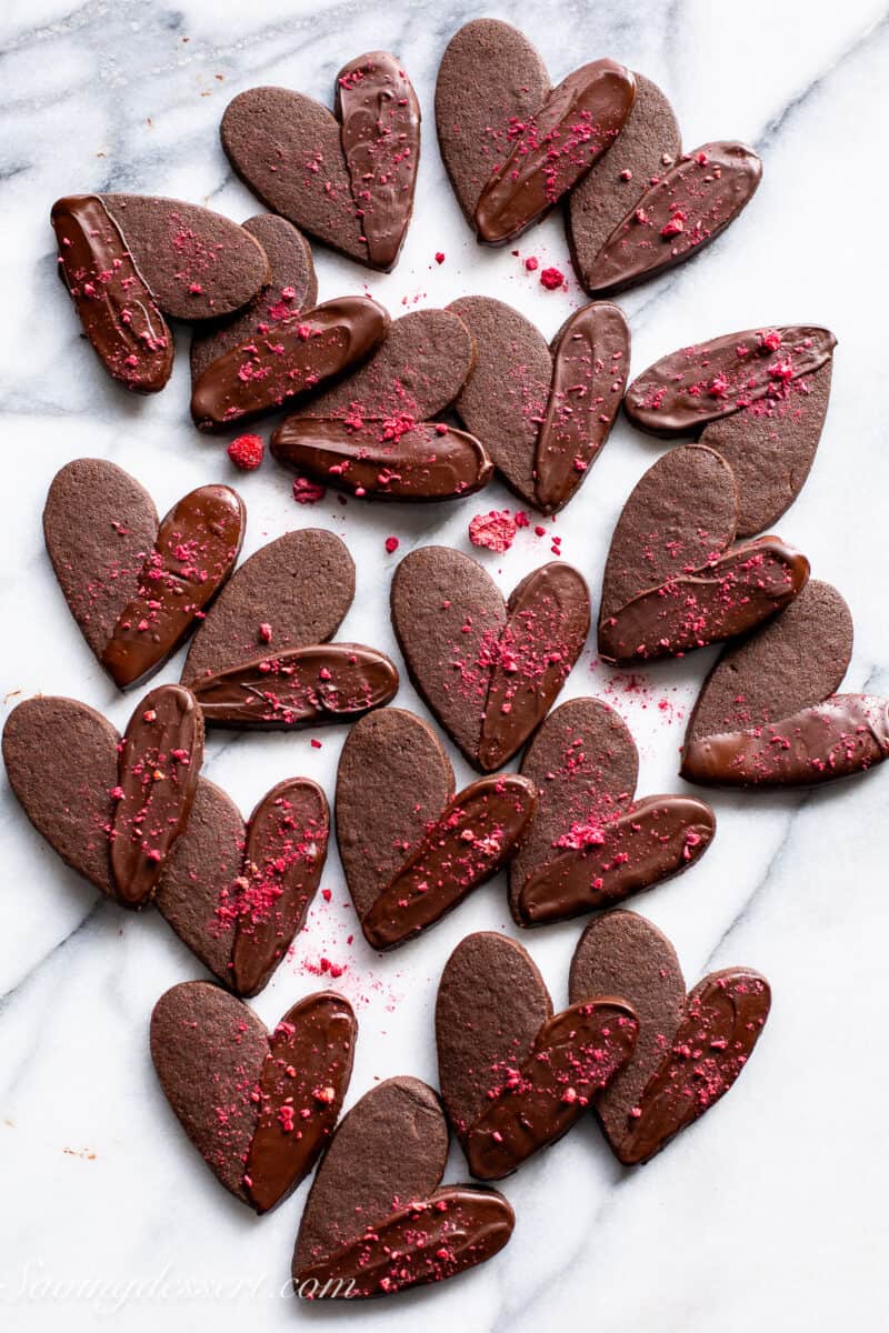An overhead shot of a pile of chocolate heart shaped Valentine's Day Cookies