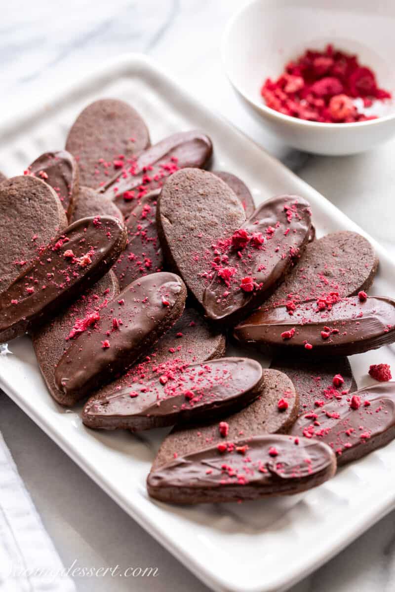 Chocolate heart shaped Valentine's Day Cookies on a small platter.