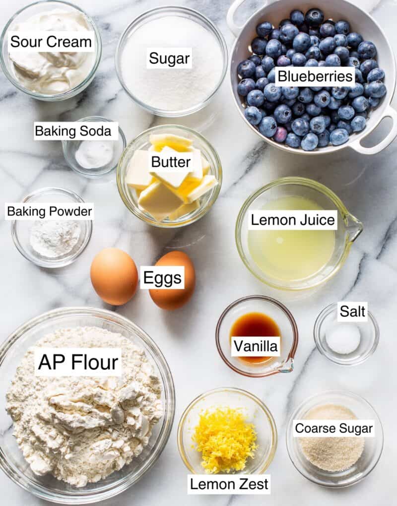 A collage of ingredients needed for blueberry lemon bread like sugar, flour, lemon juice, vanilla and eggs.