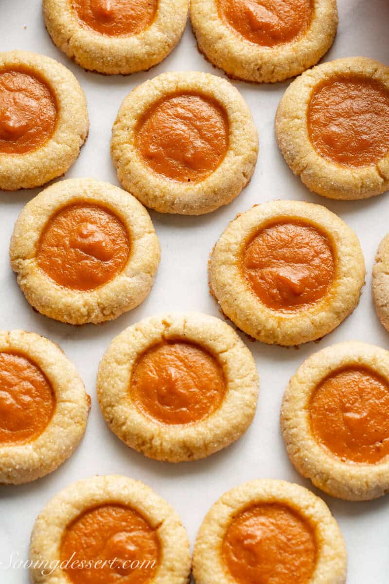 An overhead shot of pumpkin filled thumbprint cookies.
