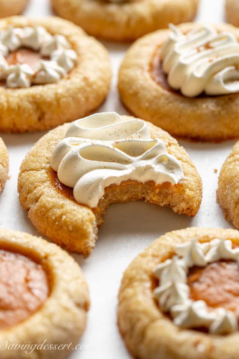 A partially eaten pumpkin pie cookie.