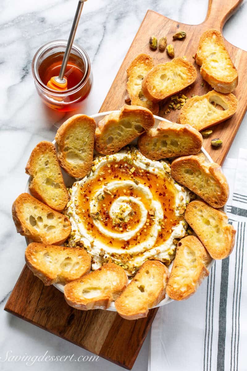 Whipped feta dip with a big swirl of hot honey served with toasted baguette slices.
