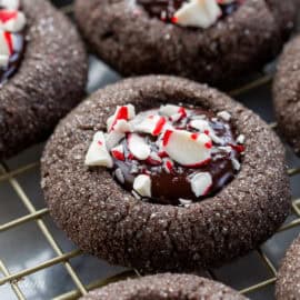A closeup of dark chocolate peppermint cookies on a cooling rack.
