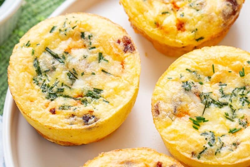 An overhead shot of a plate filled with egg muffins.