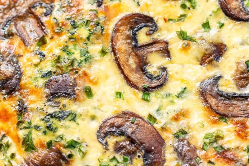An overhead view of a baked spinach quiche.