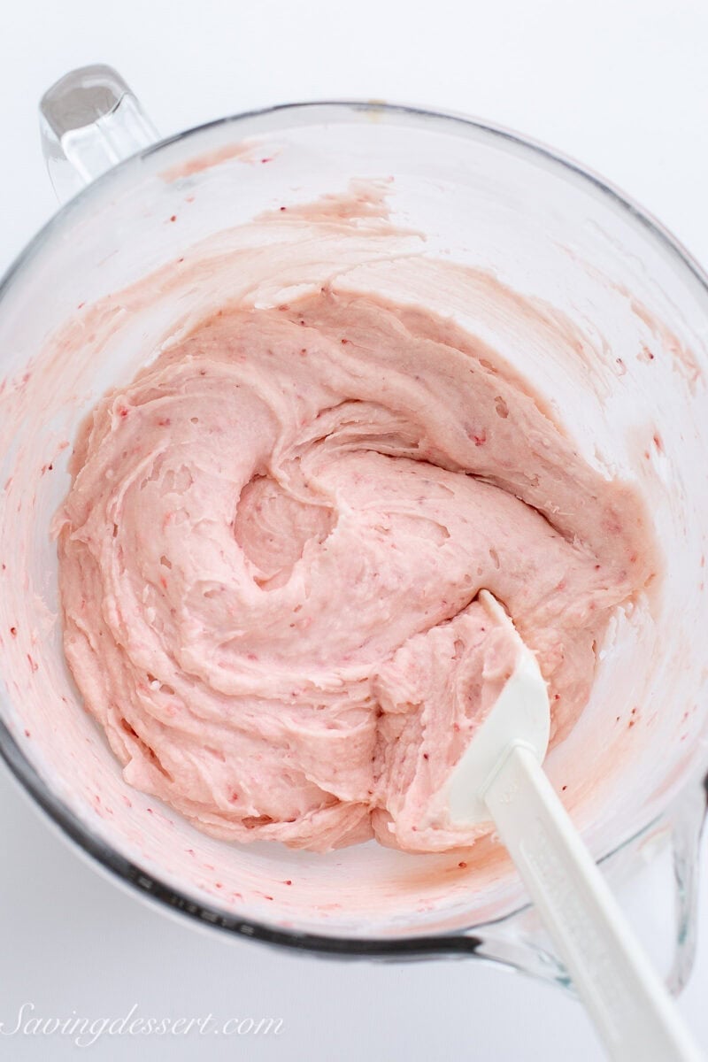 A bowl of strawberry frosting.