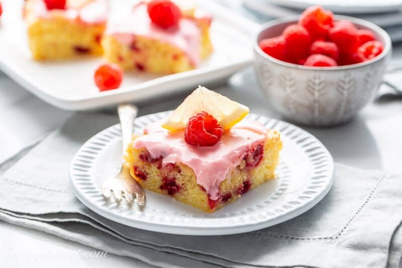 Lemon Raspberry Bars with fresh raspberries on top.