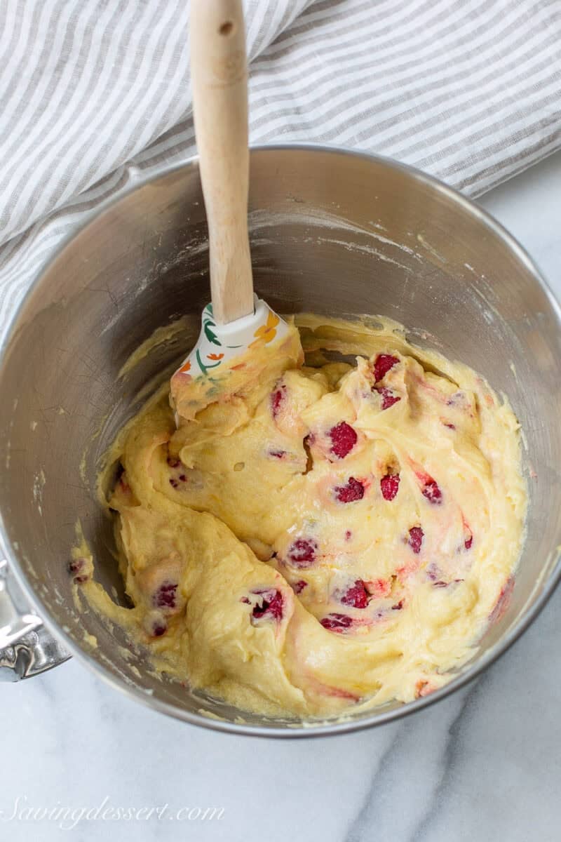 A mixing bowl with raspberry lemon bar batter.