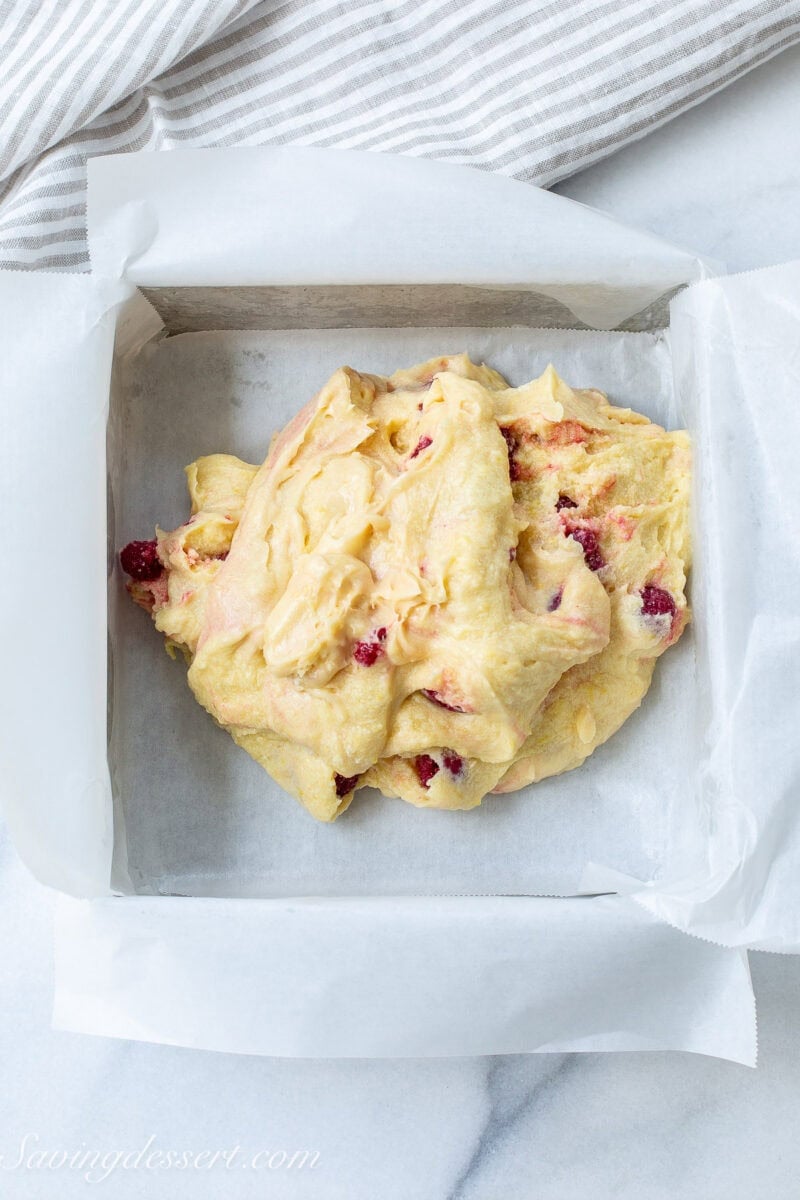 Lemon bars batter in a square pan.
