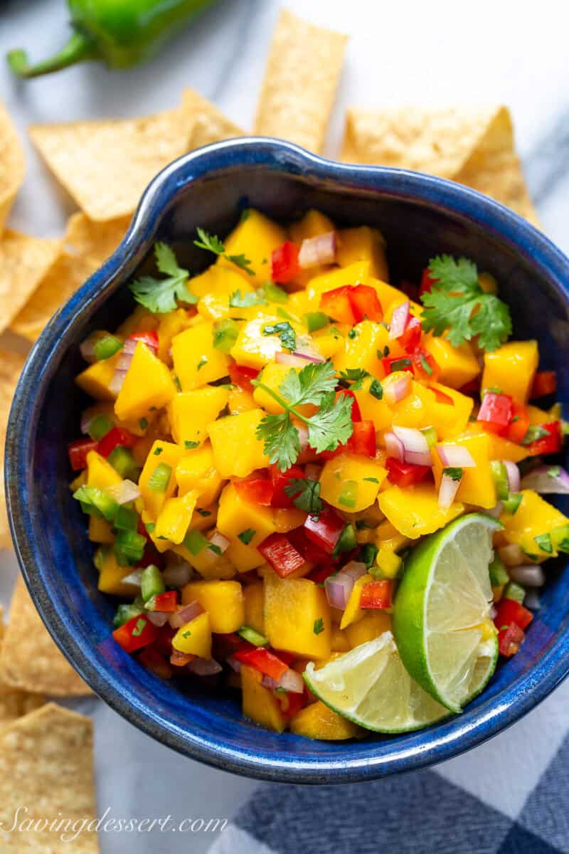 An overhead photo of a bowl of fresh mango salsa.