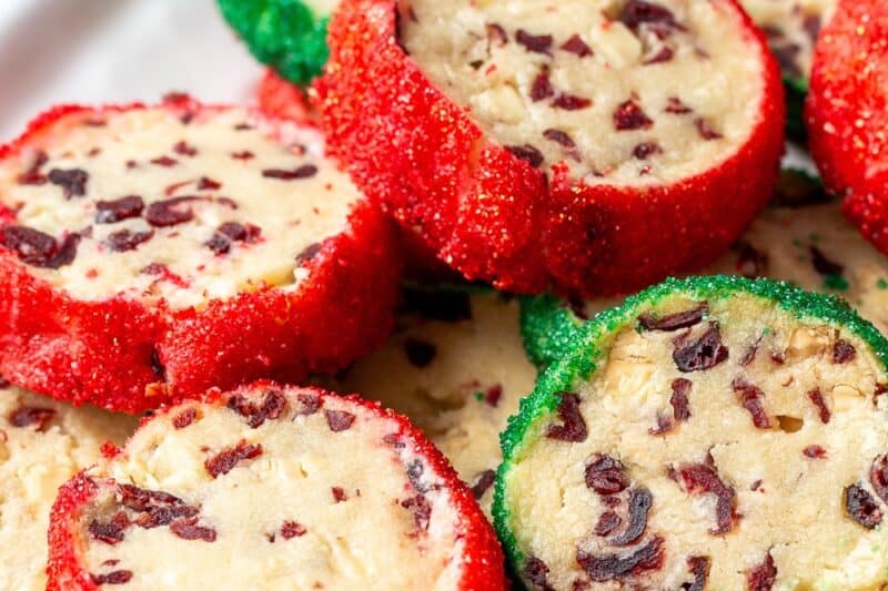 A plate with red and green decorated shortbread cookies.