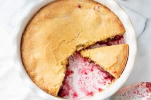 A closeup of a sliced Nantucket cranberry pie.