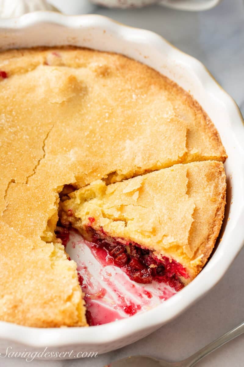 A side view of a partially sliced Nantucket Cranberry Pie.