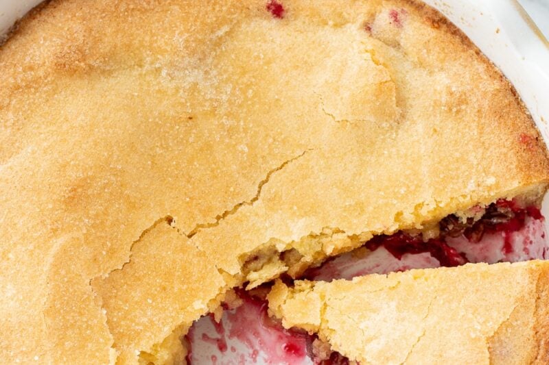 An overhead photo of a partially eaten cranberry Nantucket pie.