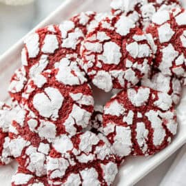 A small platter filled with red velvet crinkle cookies.