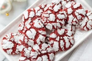 A small platter filled with red velvet crinkle cookies.