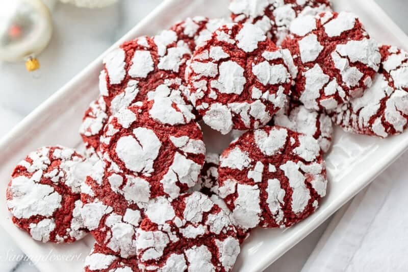 A small platter filled with red velvet crinkle cookies.