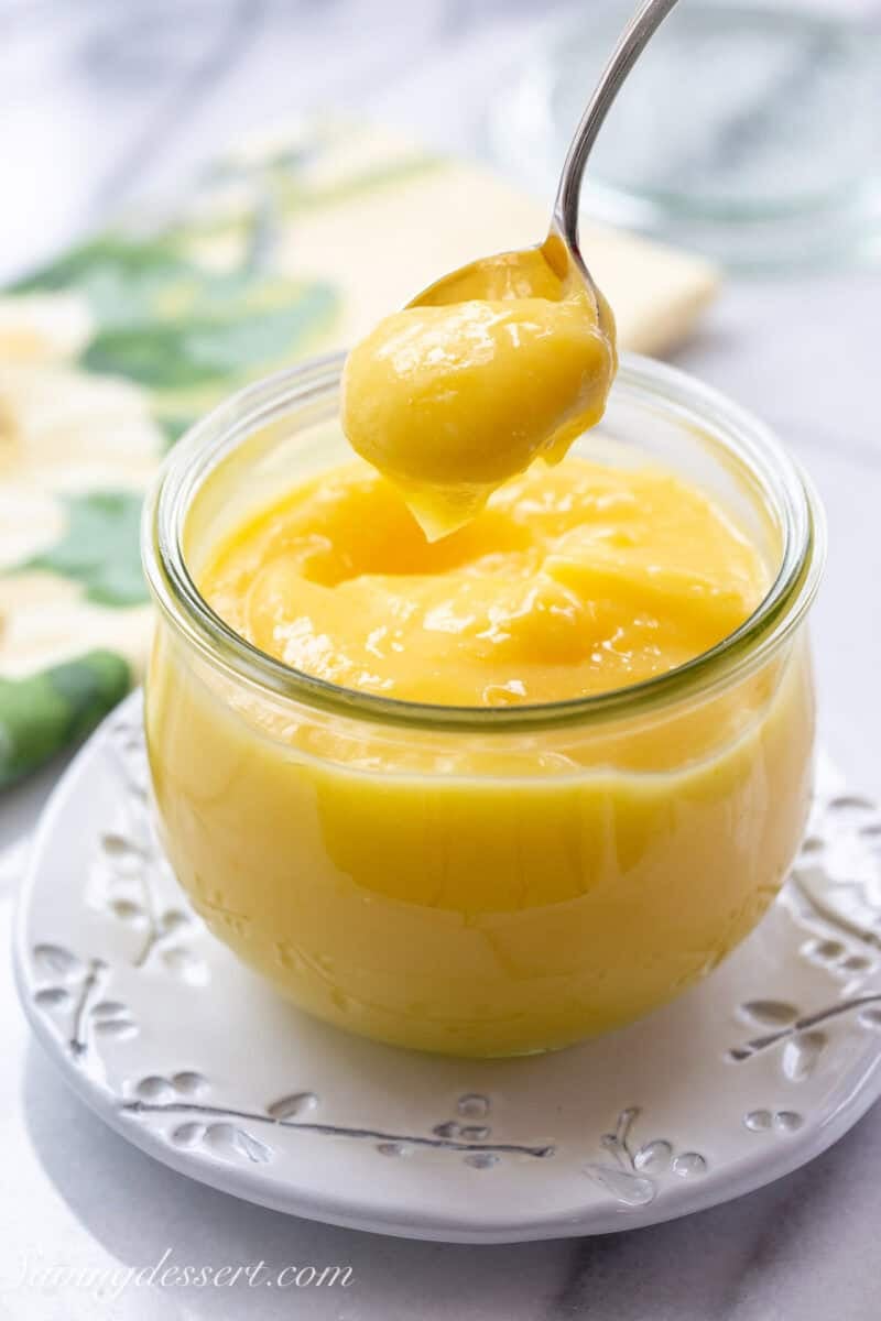 A jar filled with homemade lemon curd.