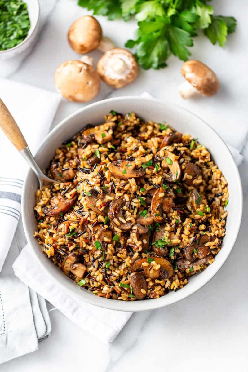 An overhead shot of a bowl of mushroom wild rice pilaf.
