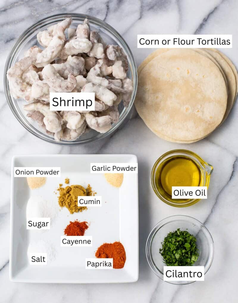 A collage of ingredients used to make shrimp tacos like spices, oil, shrimp and cilantro.