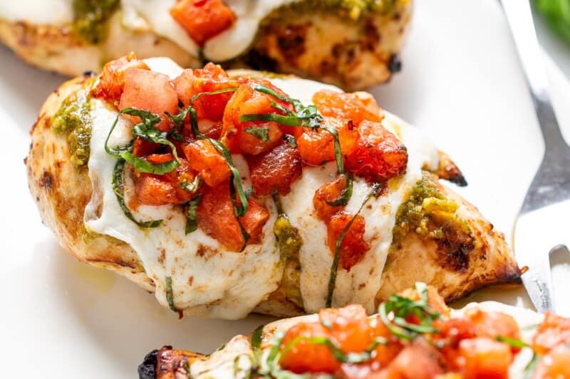 Chicken breasts topped with mozzarella, pesto and bruschetta topping.