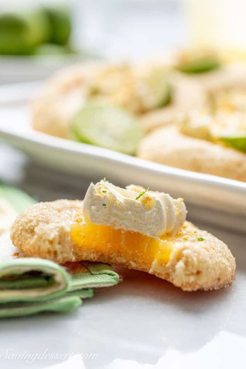 A side view of a partially eaten key lime pie cookie.